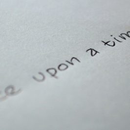 Written words 'once upon a time' written on paper