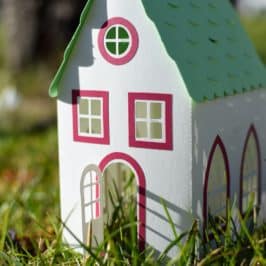Toy house in grass