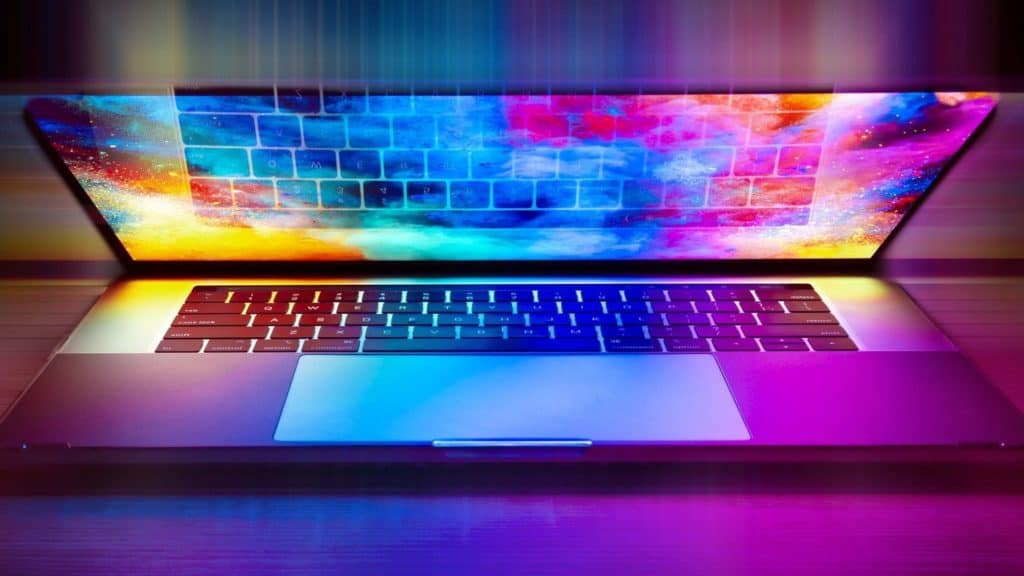 Half-open laptop with colourful lights across screen