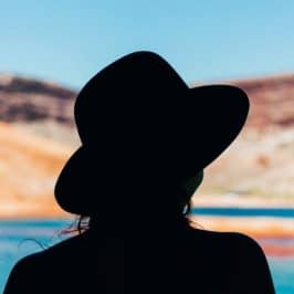 Silhouette of person wearing a hat