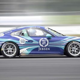Blue racing car speeding along