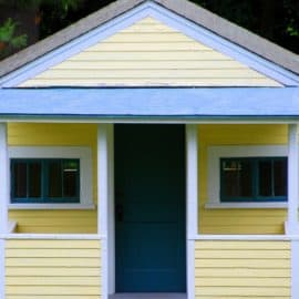 Blue-and-yellow wooden summer house