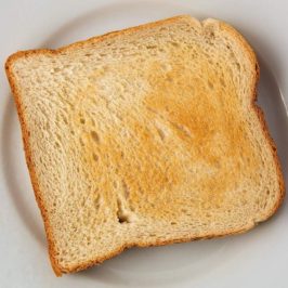 Slice of toast on a white plate